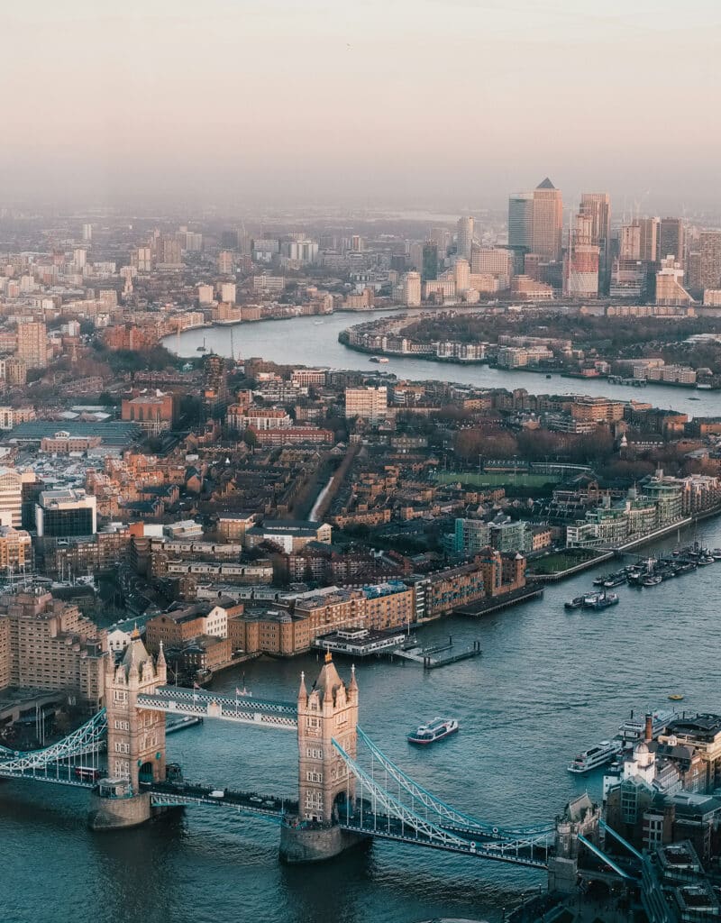 Aerial view of Tower Bridge over the River Thames with London skyline in the background